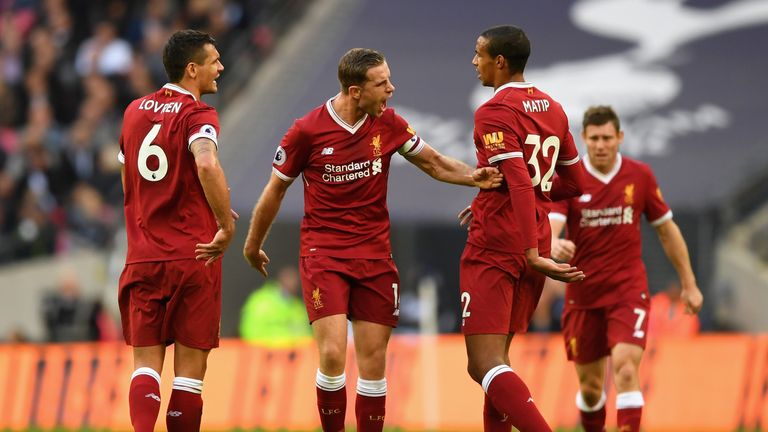 Jordan Henderson of Liverpool argues with Dejan Lovren of Liverpool and Joel Matip of Liverpool during the Premier League mat