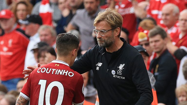 Liverpool manager Jurgen Klopp hugs Philippe Coutinho as he is substituted during the Premier League match against Manchester United