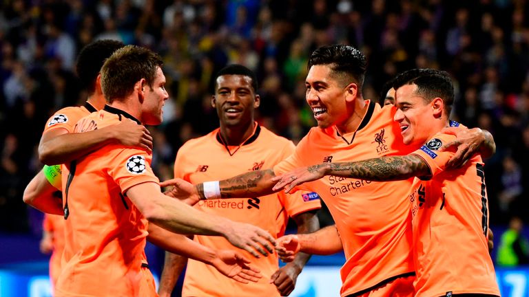 Liverpool's Brazilian forward Roberto Firmino (2nd R)  celebrates with teammates after scoring a goal during the UEFA Champions League group E football mat