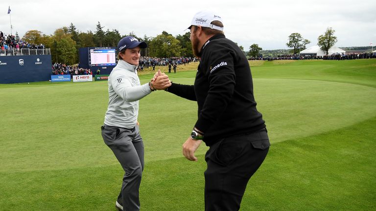NEWCASTLE UPON TYNE, ENGLAND - OCTOBER 01:  Paul Dunne of Ireland is congratulated by Shane Lowry of Ireland during day four of the British Masters at Clos