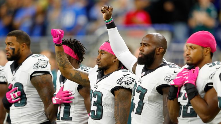 DETROIT, MI - OCTOBER 09: Ron Brooks #33 of the Philadelphia Eagles and Malcolm Jenkins #27 raise their fists during the National Anthem prior to the start