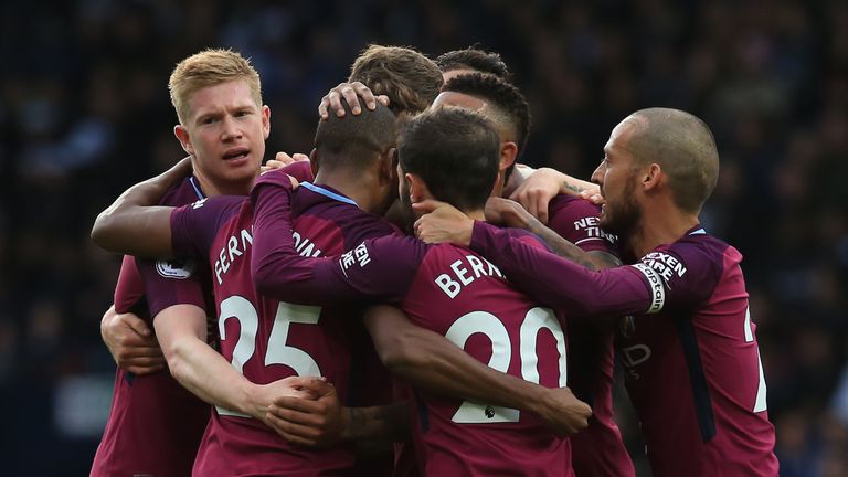 Fernandinho is mobbed by team-mates after scoring Manchester City's second