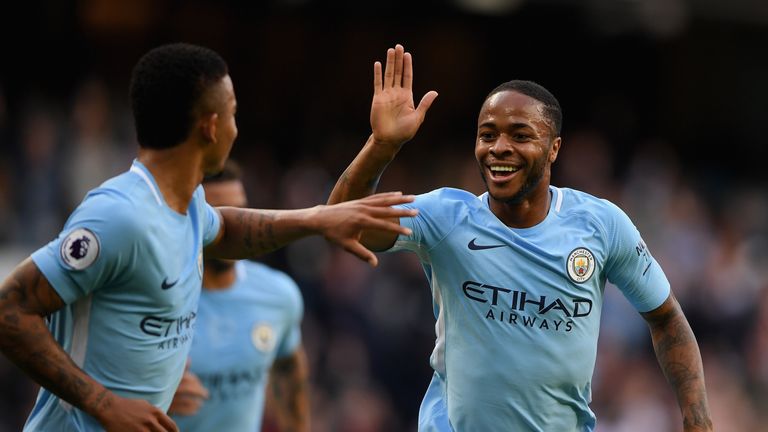 Raheem Sterling of Manchester City celebrates scoring his side's second goal against Stoke with Gabriel Jesus