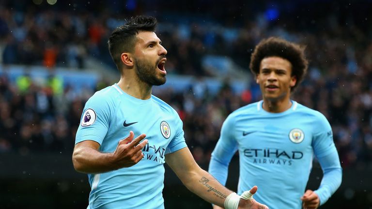 MANCHESTER, ENGLAND - OCTOBER 21:  Sergio Aguero of Manchester City celebrates as he scores their first goal from the penalty spot with Leroy Sane of Manch