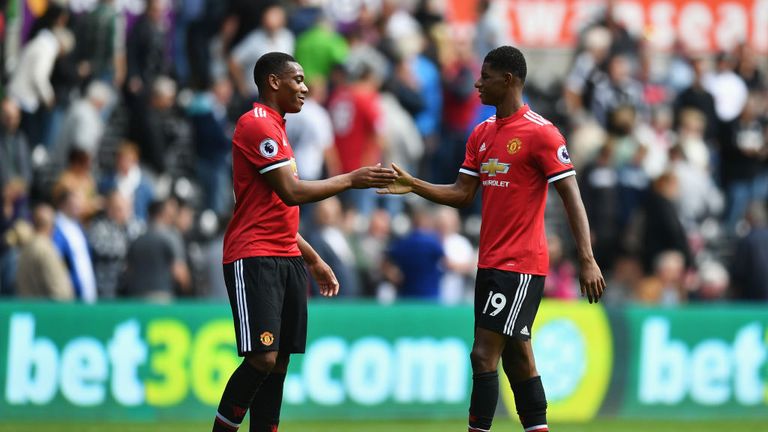 Anthony Martial of Manchester United and Marcus Rashford celebrate victory after the Premier League match at Swansea City on August 19, 2017.