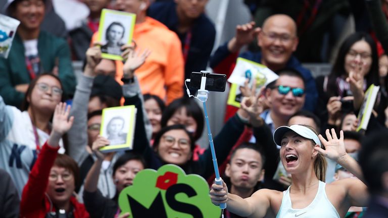 Maria Sharapova of Russia takes selfie with her fans after women's singles second round against Ekaterina Makarova