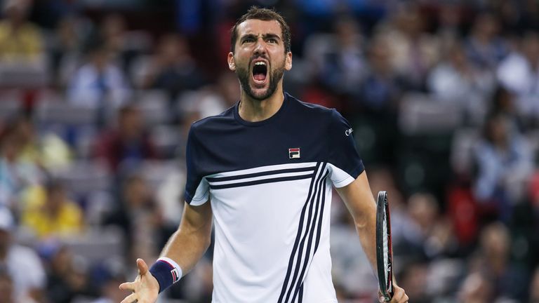 Marin Cilic of Croatia celebrates a point during the Men's singles semi-final mach against Rafael Nadal of Spain