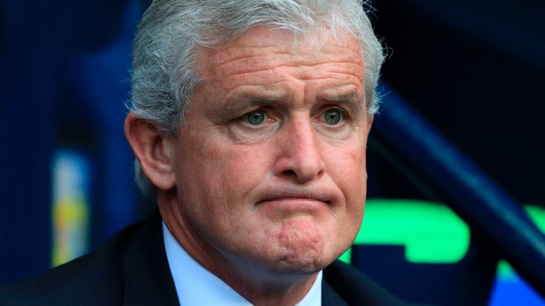 Stoke City's Welsh manager Mark Hughes waits for kick off of the English Premier League football match between Manchester City and Stoke City at the Etihad