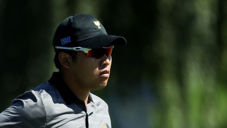 JERSEY CITY, NJ - OCTOBER 01:  Hideki Matsuyama of Japan and the International Team walks on the first hole during Sunday singles matches of the Presidents