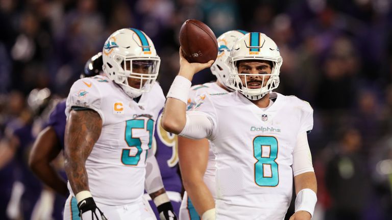 BALTIMORE, MD - OCTOBER 26: Quarterback Matt Moore #8 of the Miami Dolphins walks off the filed after being sacked in the fourth quarter at M&T Bank Stadiu