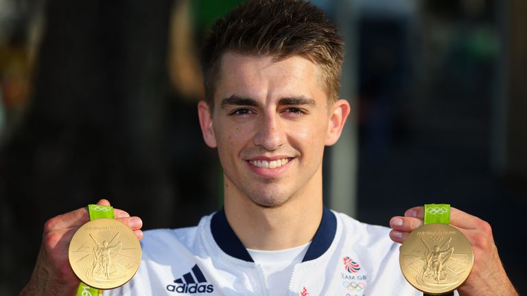 Max Whitlock holds up his two gold medals from the Rio 2016 Olympic Games