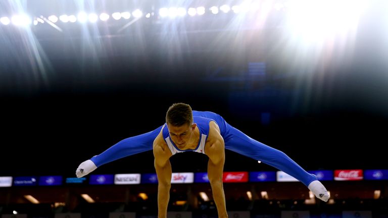 Max Whitlock of Great Britain performs a routine on the pommel horse