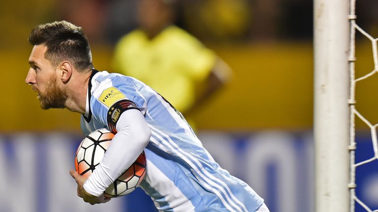 Argentina's Lionel Messi runs with the ball after scoring 