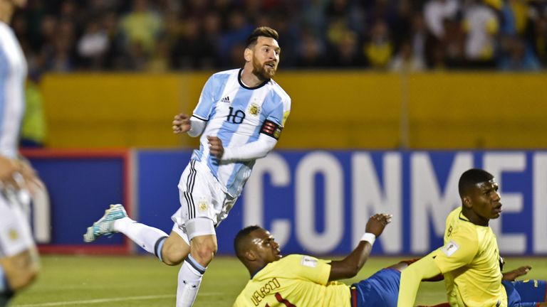 Argentina's Lionel Messi (L) celebrates after scoring the second goal against Ecuador during their 2018 World Cup qualifier football match in Quito, on Oct
