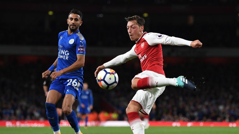 LONDON, ENGLAND - AUGUST 11:  Mesut Ozil of Arsenal takes a shoton goal during the Premier League match between Arsenal and Leicester City at the Emirates 