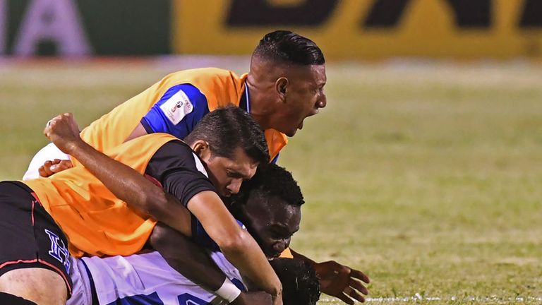 Honduras players celebrate after scoring against Mexico