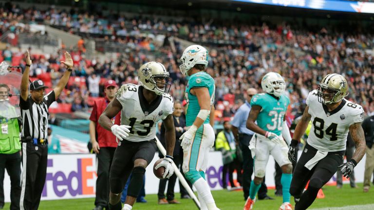 LONDON, ENGLAND - OCTOBER 01: Michael Thomas #13  of the New Orleans Saints celebrates after scoring a touchdown during the NFL game between the Miami Dolp