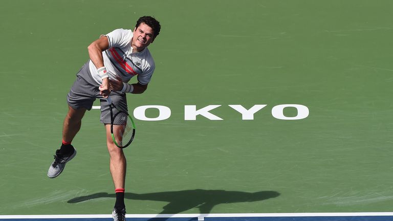 Milos Raonic serves against Viktor Troicki of Serbia during day two of the Rakuten Open at Ariake Coliseum