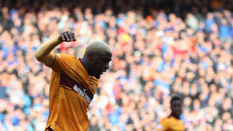GLASGOW, SCOTLAND - OCTOBER 22: James Tavernier of Rangers vies with Cedric Kipre of Motherwell during the Betfred League Cup Semi Final between Rangers an