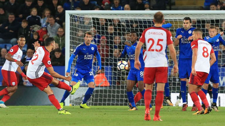 West Bromwich Albion's Belgian midfielder Nacer Chadli (2L) scores his team's first goal during the English Premier League football match between Leicester