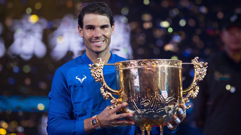 Rafael Nadal of Spain holds the trophy after winning the men's singles final match against Nick Kyrgios of Australia at the China Open tennis tournament in
