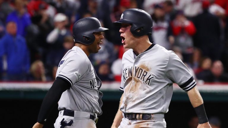 Todd Frazier (right) and  Aaron Hicks celebrate during the Yankees game five victory