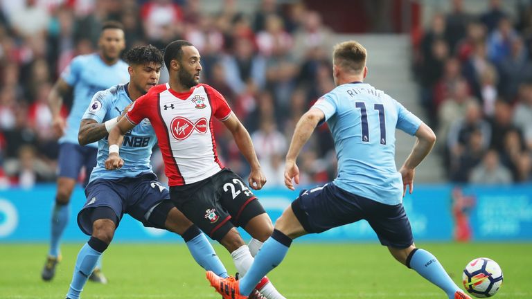 SOUTHAMPTON, ENGLAND - OCTOBER 15:  Nathan Redmond of Southampton takes on DeAndre Yedlin and Matt Ritchie of Newcastle United during the Premier League ma