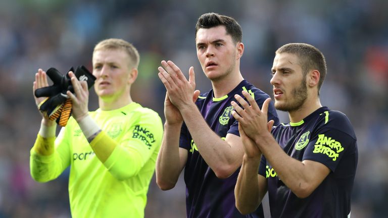 Nikola Vlasic, Michael Keane and Jordan Pickford applaud the crowd after the draw with Brighton