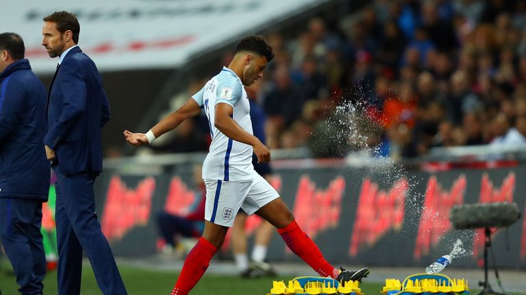 LONDON, ENGLAND - OCTOBER 05:  Alex Oxlade-Chamberlain of England reacts by kicking a bottle as he is substituted during the FIFA 2018 World Cup  Group F Q