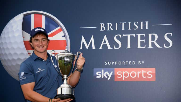 Paul Dunne of Ireland with the winners trophy after the final round of the British Masters at Close House