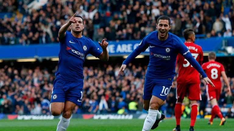 Chelsea's Spanish midfielder Pedro (L) celebrates scoring the opening goal with Chelsea's Belgian midfielder Eden Hazard during the English Premier League 