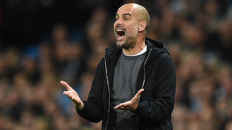 Manchester City's Spanish manager Pep Guardiola shouts instructions to his players from the touchline during the UEFA Champions League Group F football mat