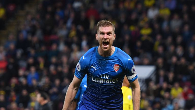 Per Mertesacker celebrates after putting Arsenal 1-0 up against Watford