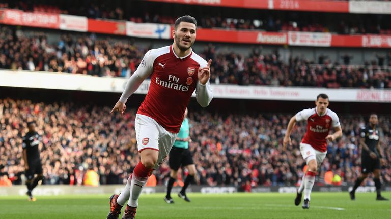 Sead Kolasinac celebrates his second-half equaliser against Swansea at the Emirates Stadium