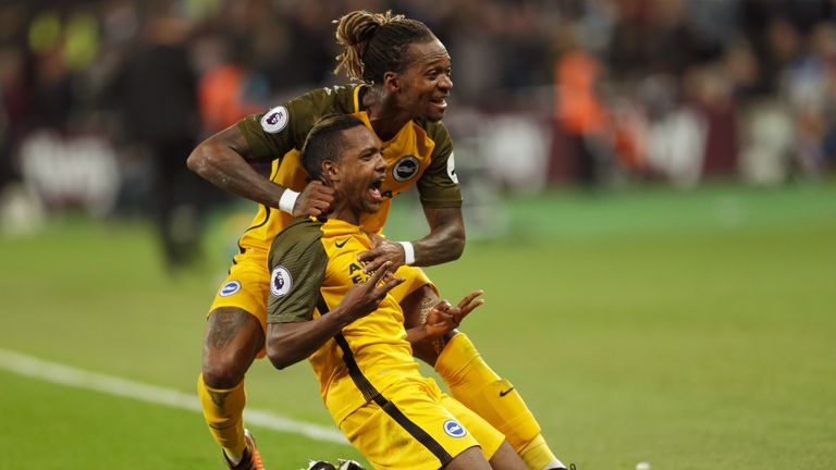 Jose Izquierdo of Brighton and Hove Albion (front) celebrates as he scores their second goal with Gaetan Bong during the Premier League match at West Ham
