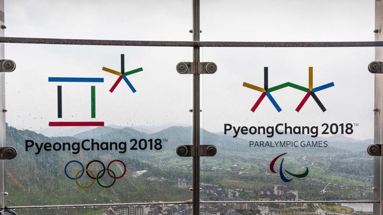This picture taken on September 27, 2017 shows the Alpensia resort through a glass railing showing the logo of the Pyeongchang Winter Olympic Games in Pyeo