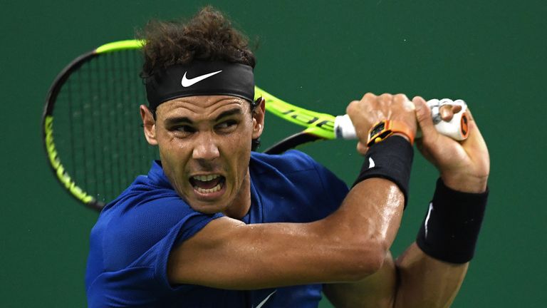 Rafael Nadal of Spain hits a return during his men's third round singles match against Fabio Fognini of Italy at the Shanghai Masters