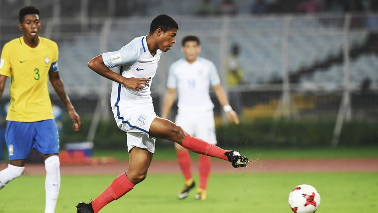 Rhian Brewster of England scores a goal against Brazil during the semifinal football match in the FIFA U-17 World Cup at the Vivekananda Yuba Bharati Krira