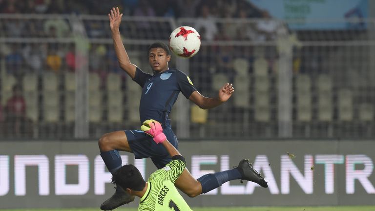 Rhian Brewster of England shoots past Justin Garces of USA to score the second goal during the quarterfinal football match between USA and England in the F