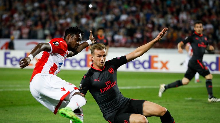 Rob Holding slides in on Richmond Boakye in the first half