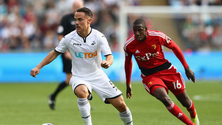 SWANSEA, WALES - SEPTEMBER 23:  Roque Mesa of Swansea City is tracked by Abdoulaye Doucoure of Watford during the Premier League match between Swansea City