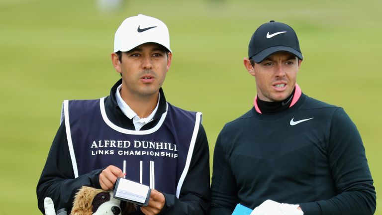 ST ANDREWS, SCOTLAND - OCTOBER 08: Rory McIlroy of Northern Ireland speaks with his caddie during the final round of the 2017 Alfred Dunhill Championship a
