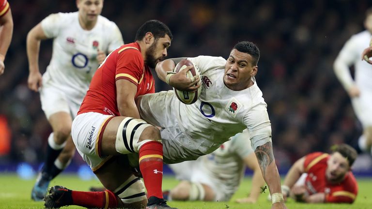 Nathan Hughes is tackled by Wales No 8 Taulupe Faletau during 2017 Six Nations