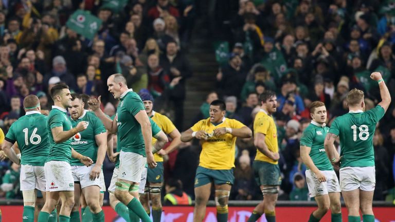 Ireland's players celebrate their win on the pitch after the rugby union test match between Ireland and Australia at the Aviva stadium in Dublin on Novembe