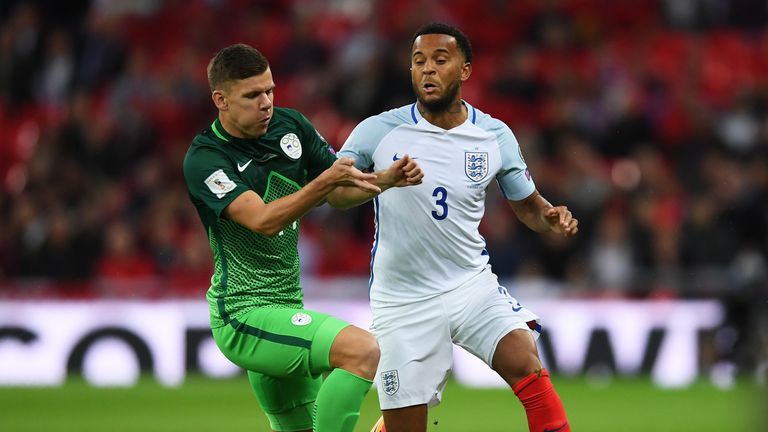 Ryan Bertrand of England and Roman Bezjak of Slovenia battle for the ball during the FIFA 2018 World Cup  Group F Qualifier 