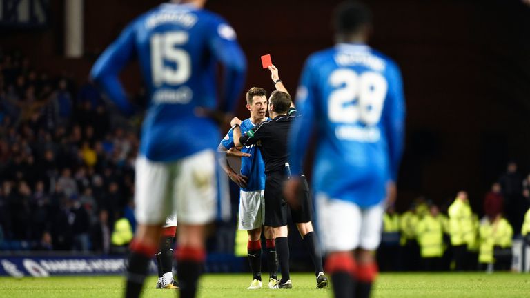 Ryan Jack (centre) is sent off during the dramatic finish at Ibrox