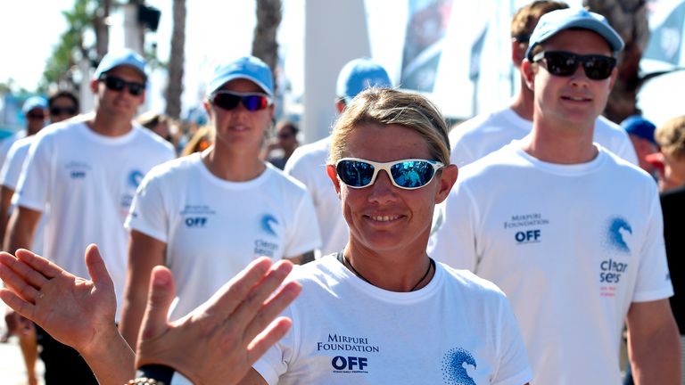 Clean Seas racing team's Liz Wardley gives a high-five before the start of an in-port race off the coast of Alicante, southeastern Spain, on October 14, 20