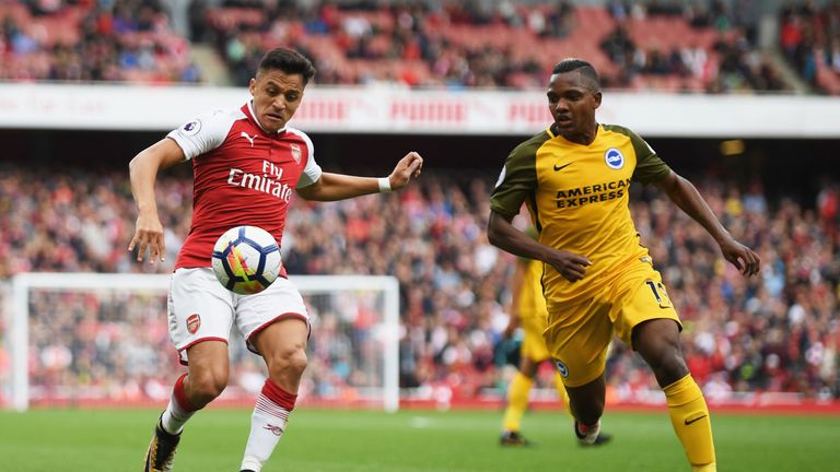 Alexis Sanchez of Arsenal is put under pressure from Jose Izquierdo of Brighton and Hove Albion during the Premier League match