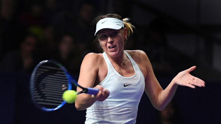 Russia's Maria Sharapova returns the ball to Slovakia's Magdalena Rybarikova during the women's singles first round tennis match at the Kremlin Cup tennis 