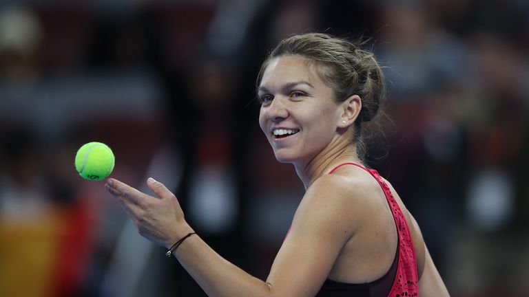 BEIJING, CHINA - OCTOBER 04:  Simona Halep of Romania celebrates after winning the Maria Sharapova of Russia during the Women's singles 3rd round on day fi